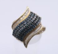 A 9 ct gold dress ring. Ring size N/O. 3.6 grammes total weight.