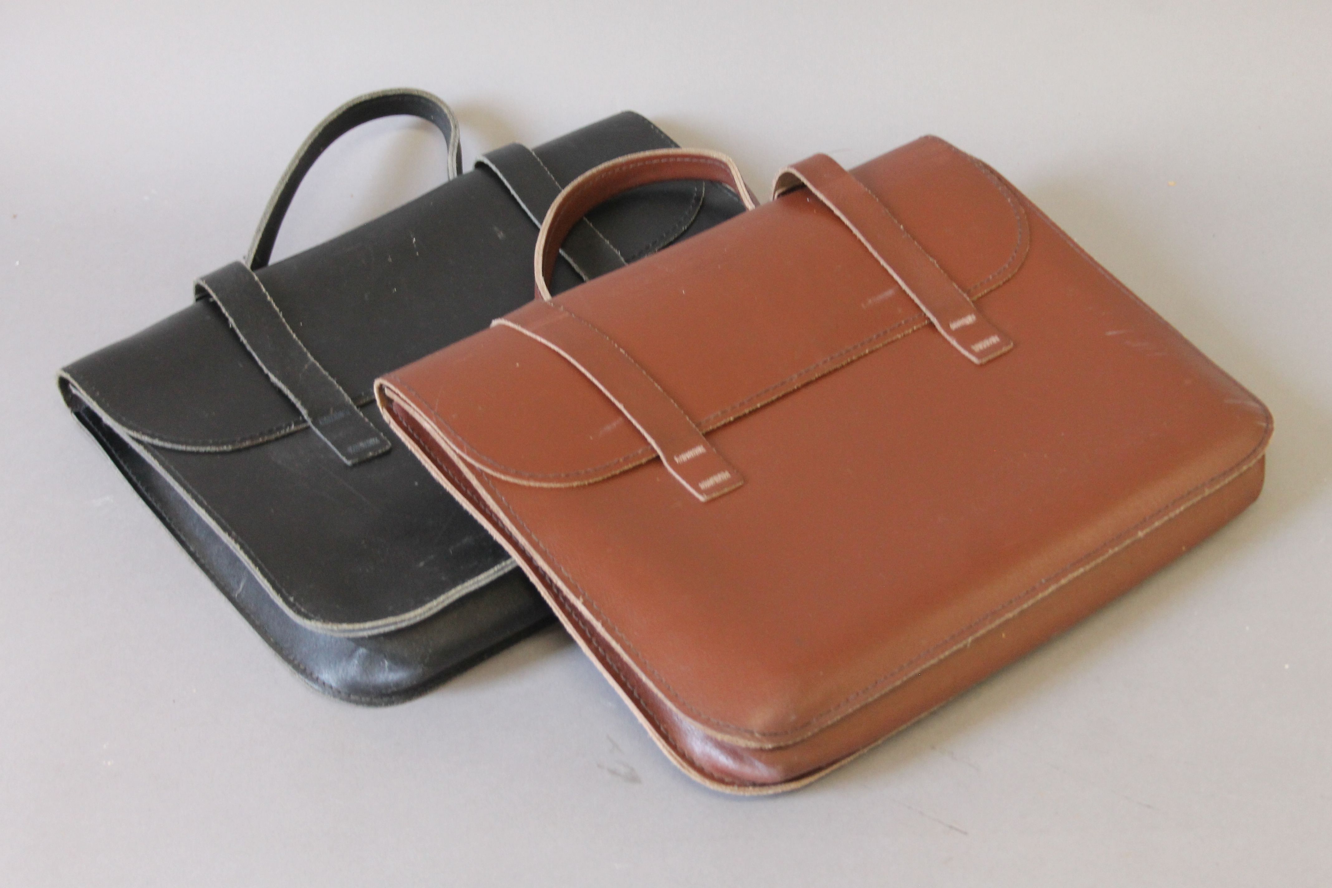 Two vintage leather music bags. 37.5 cm wide.
