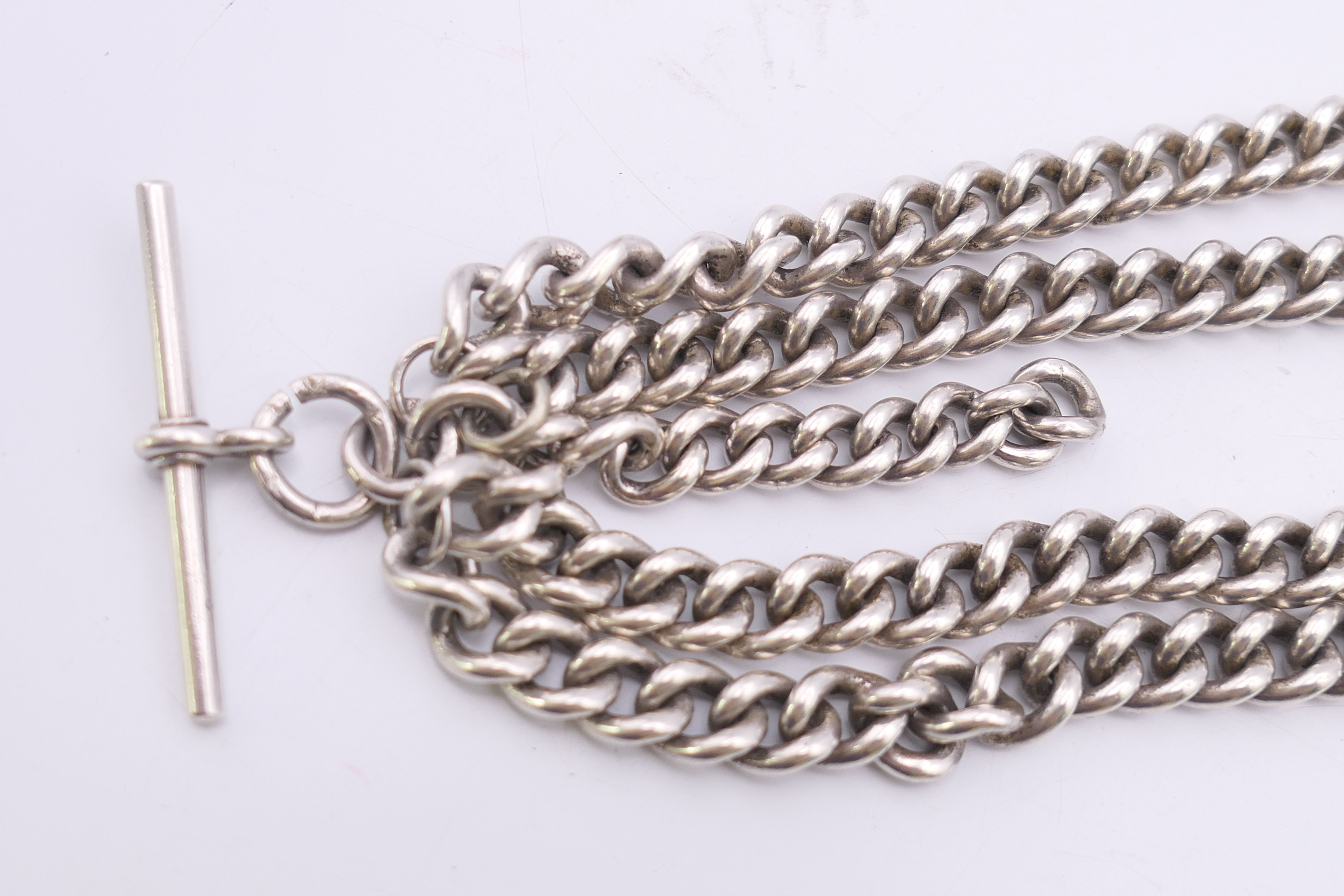 A silver curb link double Albert watch chain. 54.5 cm long. 145.5 grammes. - Image 5 of 5