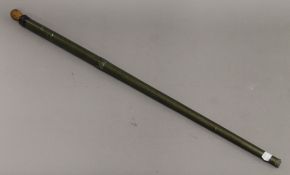 A 19th century gold plated porcelain parasol handle mounted on a cane. The handle 20.5 cm long.