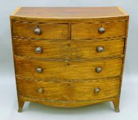 A 19th century cross banded mahogany bow front chest of drawers. 107 cm wide.