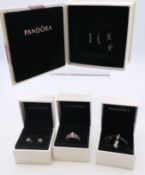 A collection of boxed silver Pandora jewellery items.