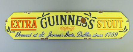 An enamel Guinness sign. 57 cm long.