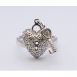 A silver heart cubic zirconia ring. Ring size K.