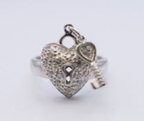 A silver heart cubic zirconia ring. Ring size K.