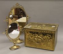 Two vintage oval brass table mirrors on stands and a brass covered fireside box.
