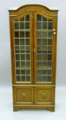 An early 20th century lead glazed oak bookcase. 191 cm high.