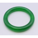 An apple green jade bangle. 6.5 cm inner diameter.