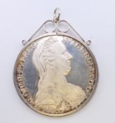 A Maria Theresa Thaler silver coin. 4 cm diameter. 32 grammes.