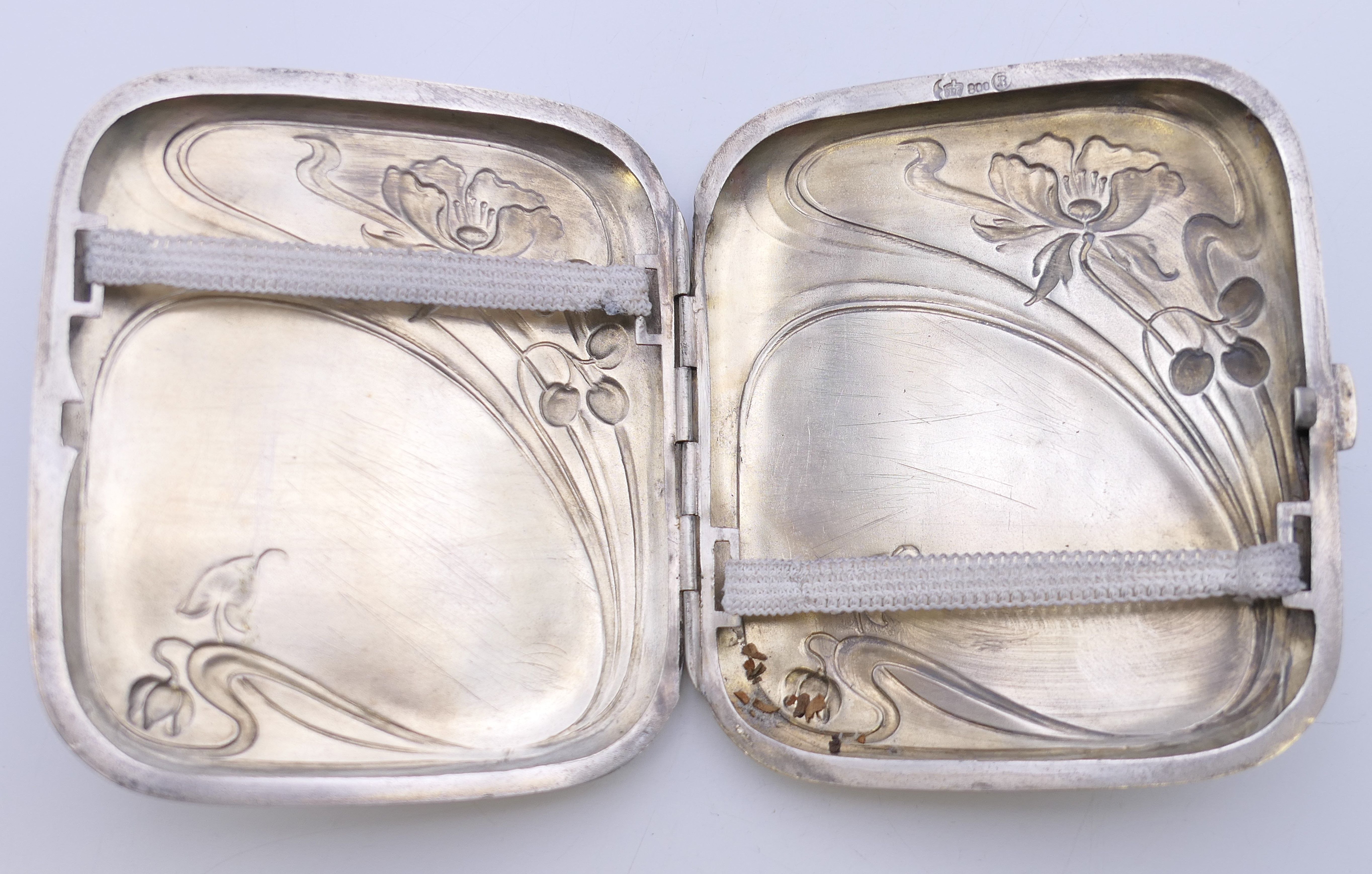 An Art Nouveau 800 silver cigarette case. 8 cm wide. 78.6 grammes total weight. - Image 7 of 8