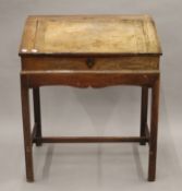 A 19th century mahogany clerk's desk. 76 cm wide.