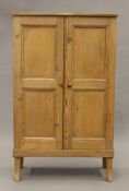 A 19th century pine side cupboard. 62 cm wide.
