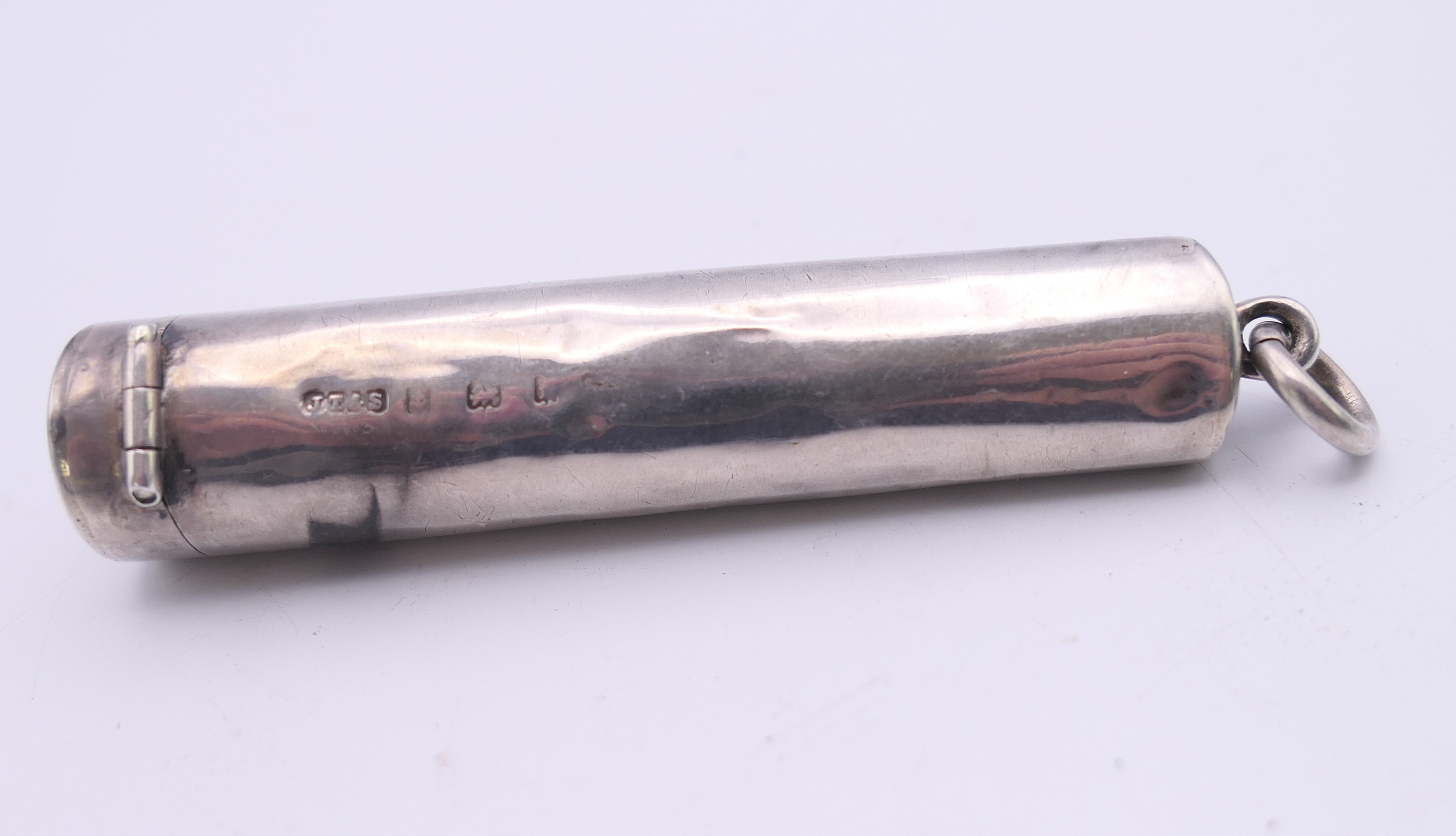 A silver case enclosing a cheroot holder, hallmarked for Birmingham. 7 cm long. 12. - Image 3 of 6