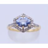 An 18 ct gold Ceylon sapphire and diamond ring. 10 mm x 10 mm. Ring size L/M. 3.