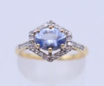 An 18 ct gold Ceylon sapphire and diamond ring. 10 mm x 10 mm. Ring size L/M. 3.