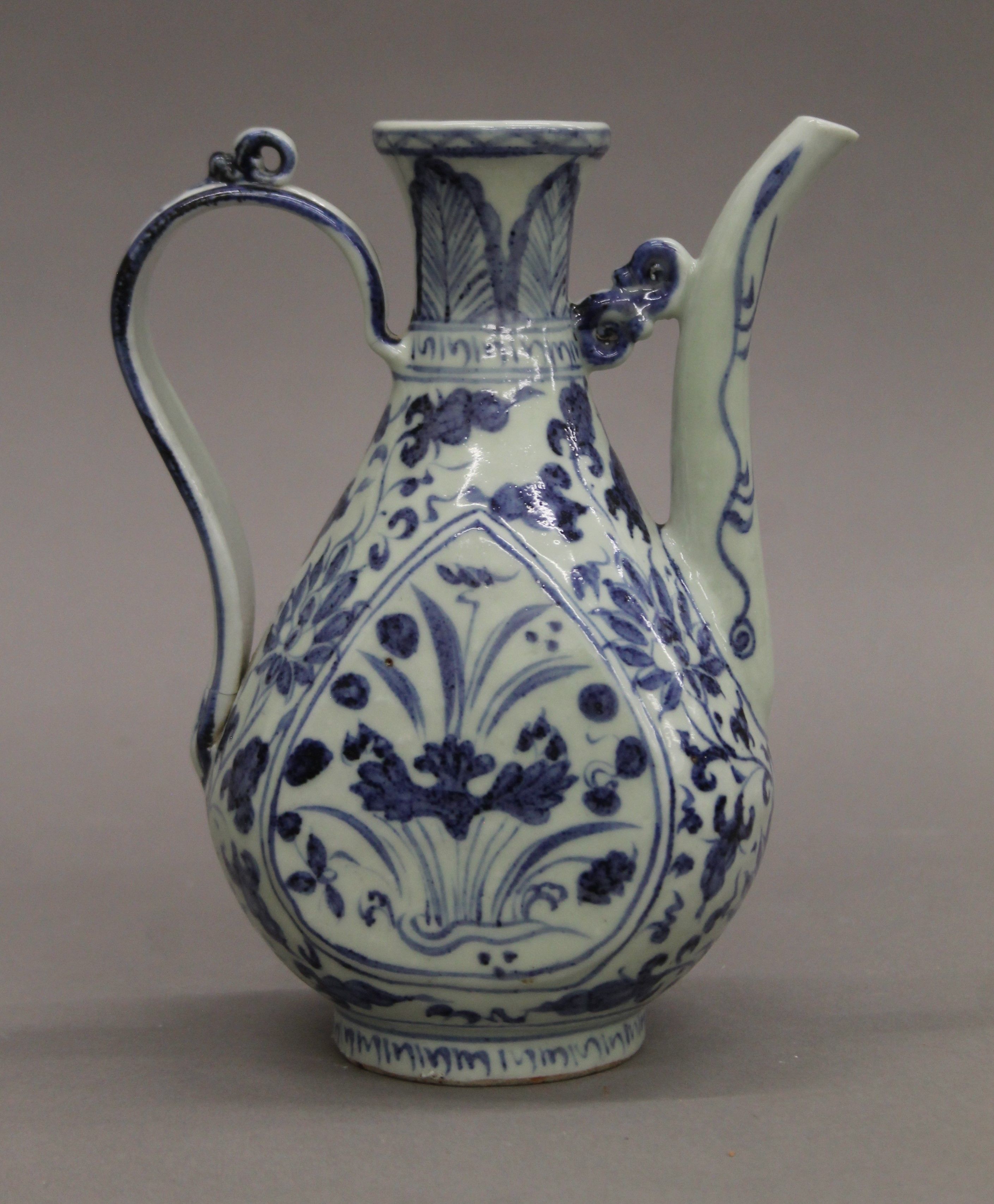 A Chinese blue and white porcelain ewer. 19 cm high. - Image 2 of 5