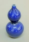 A small Chinese double gourd dark blue porcelain vase. 11 cm high.