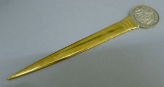 A cased National Bank of Greece silver topped letter opener. 18 cm long.