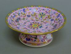 A Chinese pink porcelain tazza. 19 cm diameter.