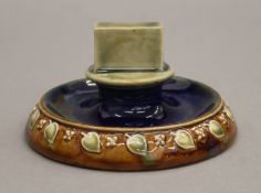 A Royal Doulton stoneware matchbox holder. 11 cm diameter.