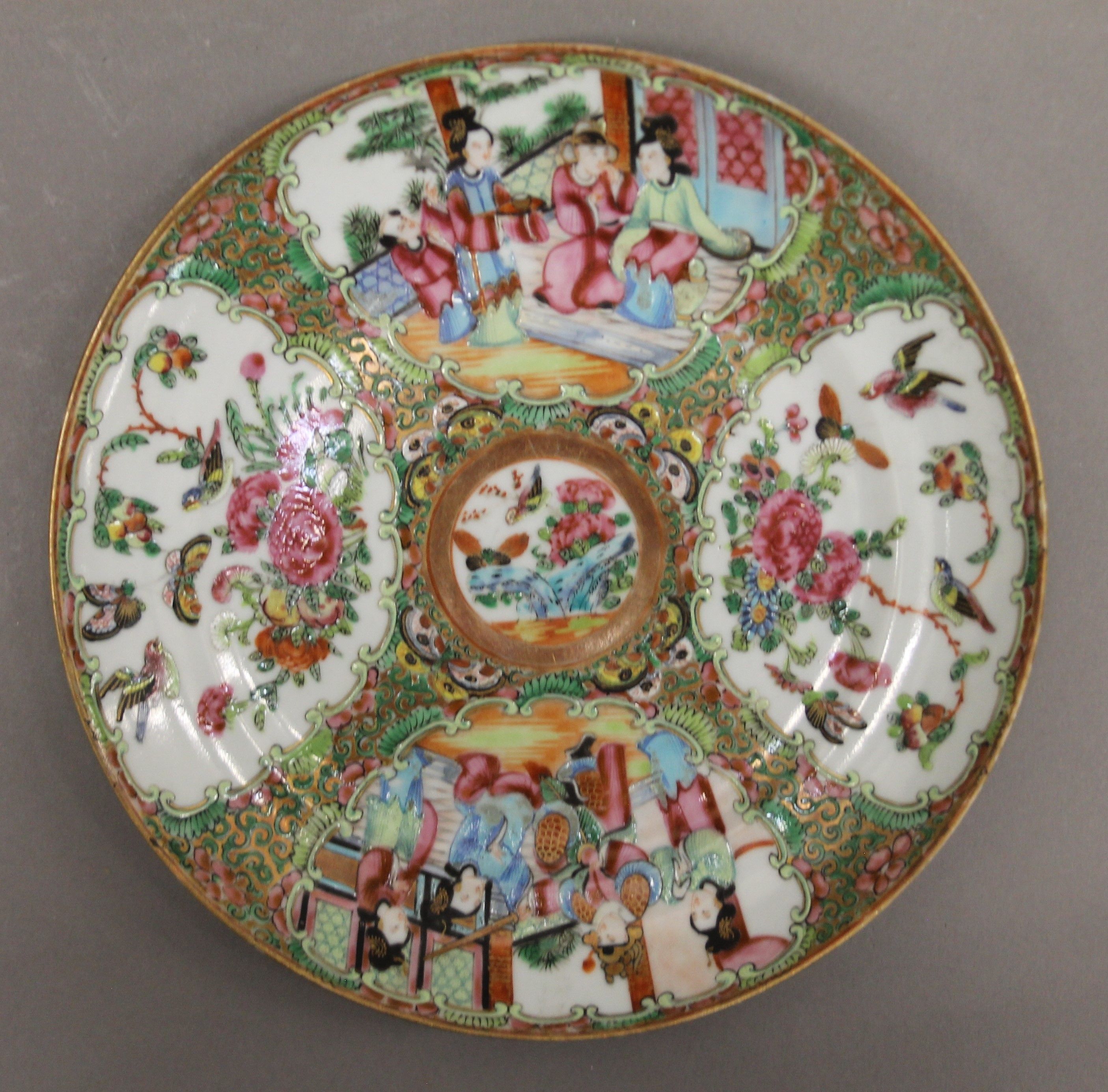 A 19th century Chinese Canton famille rose plate decorated with deities, butterflies, - Image 2 of 4