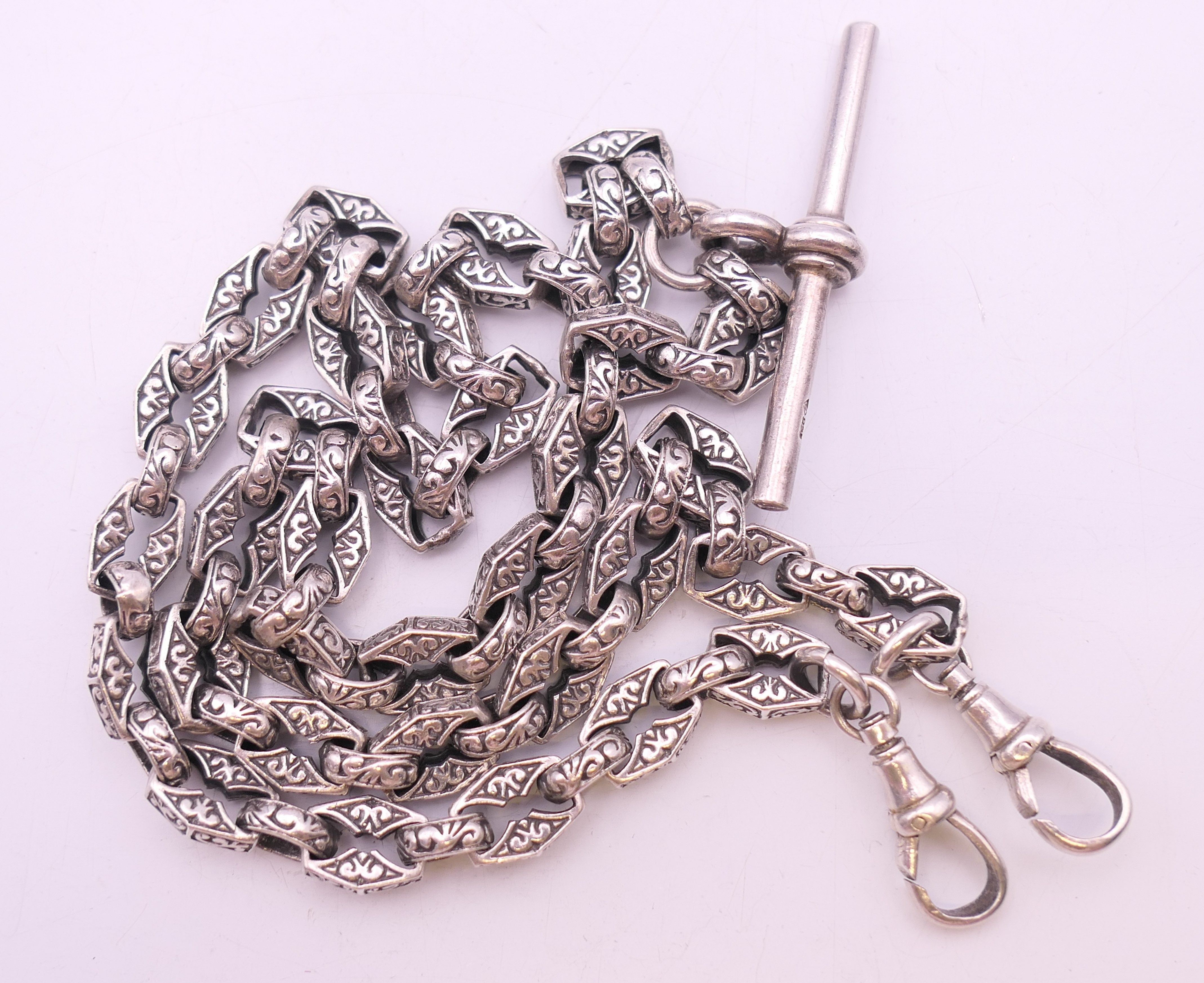 A silver watch chain with patterned links. 49 cm long. 49.1 grammes. - Image 6 of 7