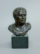 A small classical bronze bust. 14 cm high.
