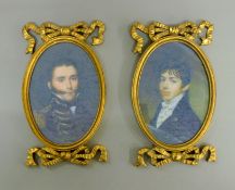 A pair of gold coloured framed miniatures. 24 cm high.