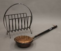 A wrought iron log rack and a warming pan. The former 56 cm high.
