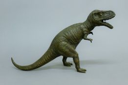 A bronze model of a Tyrannosaurus Rex. 26.5 cm high.