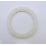 A white jade bangle. 6 cm inner diameter.