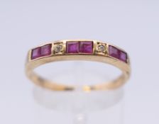 A 9 ct gold ruby and diamond ring (shank split). Ring size P/Q. 1.9 grammes total weight.
