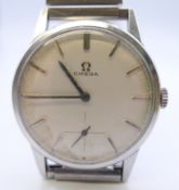 A stainless steel gentlemen's Omega wristwatch, on associated strap. 3.5 cm wide.