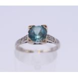 An 18 ct white gold and platinum diamond and topaz ring. Ring size M/N. 3.2 grammes total weight.