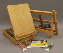A modern easel and a modern folding paint box easel. The latter 26.5 cm wide when closed.