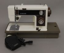 A 1970s sewing machine. 46 cm long.