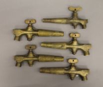 A small quantity of brass beer barrel taps.