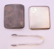 Two silver cigarette cases and a pair of silver tongs. 193 grammes total weight.