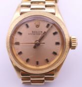 A ladies 18 K gold Rolex Oyster Perpetual wristwatch (clasp pin lacking). 2.5 cm wide. 55.