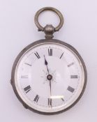 A silver fob watch. 3.75 cm diameter.