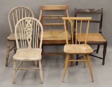 Five various chairs, including a rush seated open arm chair. 53 cm wide.