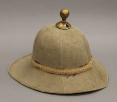 A pith helmet in a hat tin.