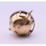 A 9 ct gold and silver Masonic ball pendant, opening into a flower. 1.5 cm high closed. 7.