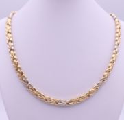 An 18 ct gold hollow link necklace. 44 cm long. 29.5 grammes.