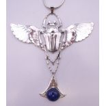 A silver scarab and lapiz pendant on chain. The pendant 9 cm high.