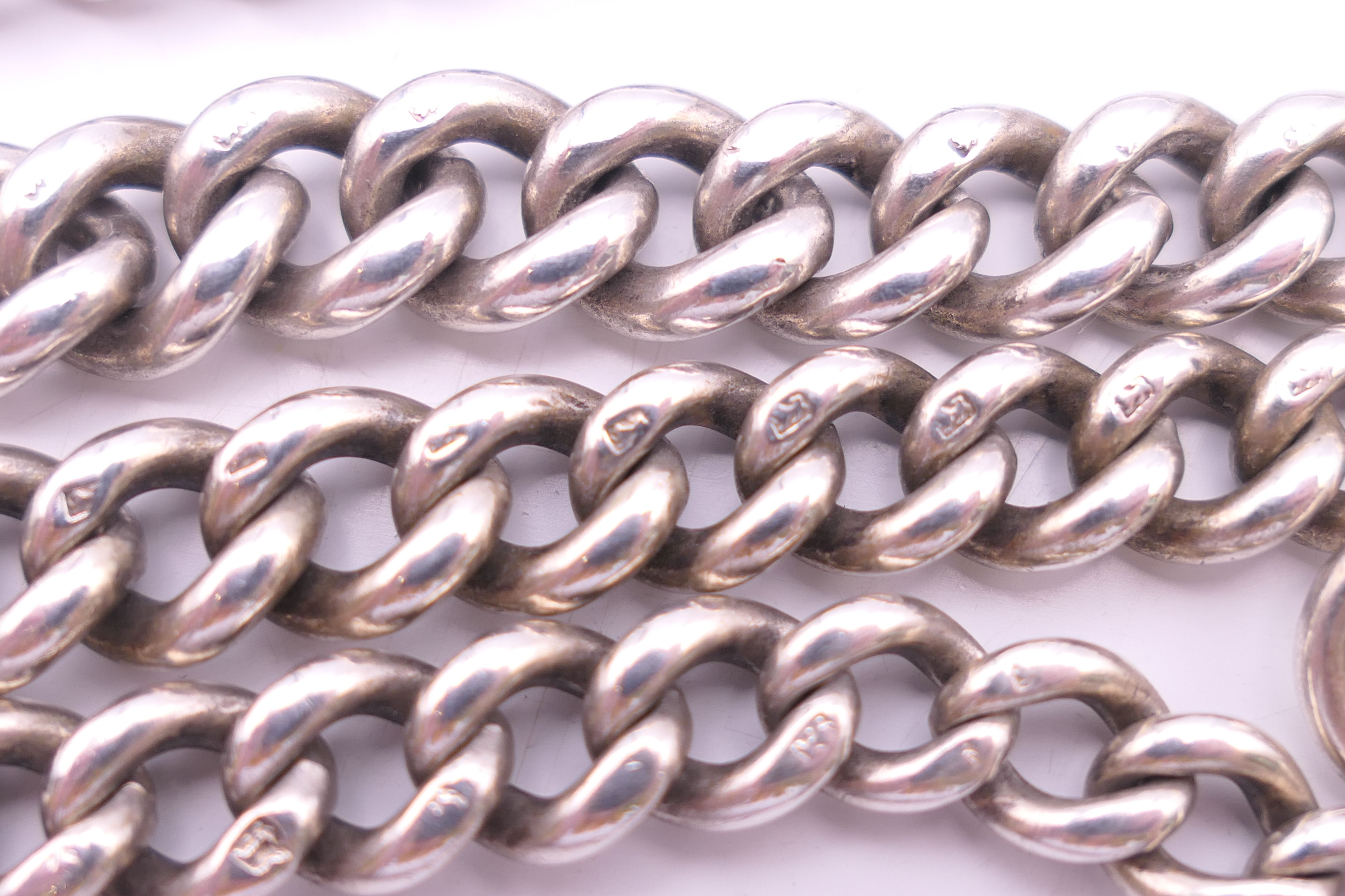 A silver watch chain. 67 cm long. 98.4 grammes. - Image 2 of 7