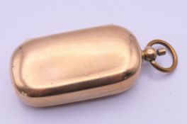 An 18 ct rolled gold sovereign case. 6.5 cm high.