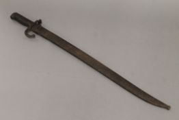 A bayonet in metal scabbard. 71 cm long.