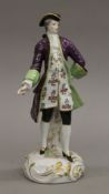 A 19th century porcelain model of a dandy. 24 cm high.