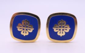 A pair of cufflinks, stamped Patek Phillipe, with certificate. 2 cm squared.